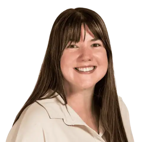 Professional woman smiling in an educational setting, representing Education Behavior Consultants.