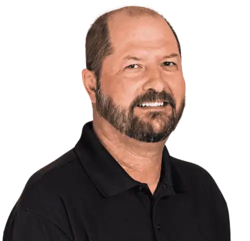 Professional Educational Behavior Consultant smiling in black polo shirt.