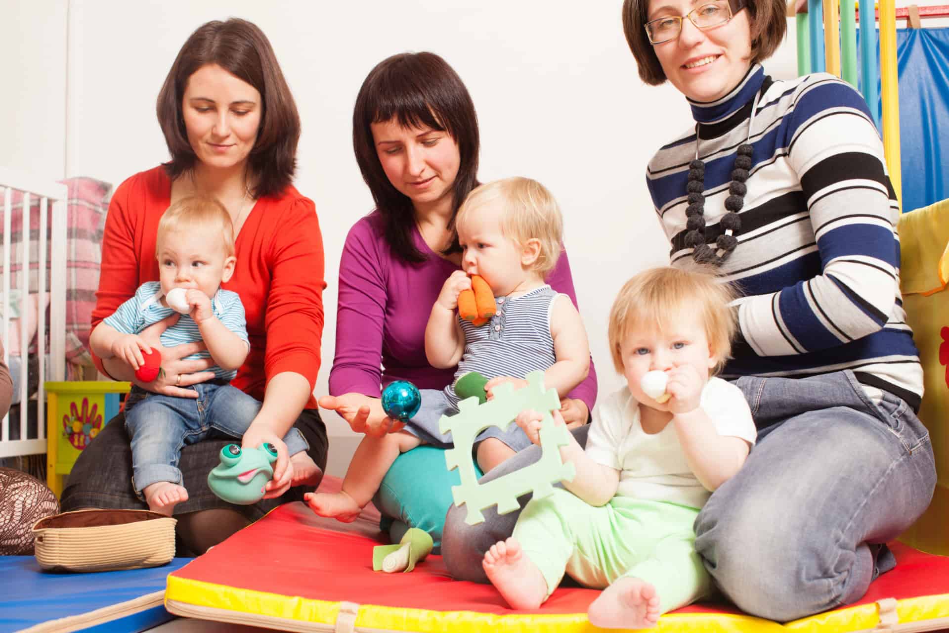 Young children with autism engaging in therapy session at Education Behavior Consultants.