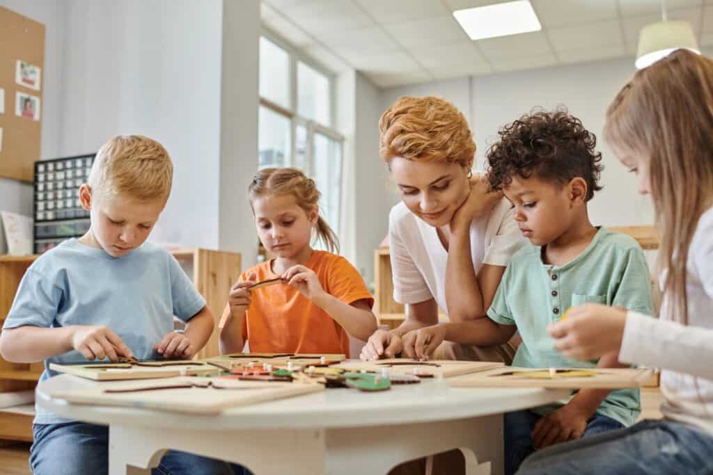 Therapy session with children focused on behavior and learning skills in a classroom setting.