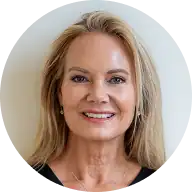 Professional woman smiling, representing Education Behavior Consultants services.