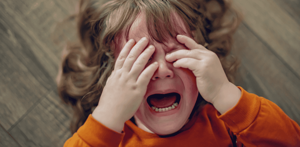 Child crying and upset, emotional distress, behavioral issues.