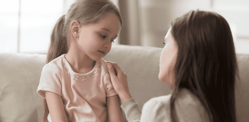 Child and caregiver sharing a comforting moment, emphasizing emotional support and behavioral guidan.