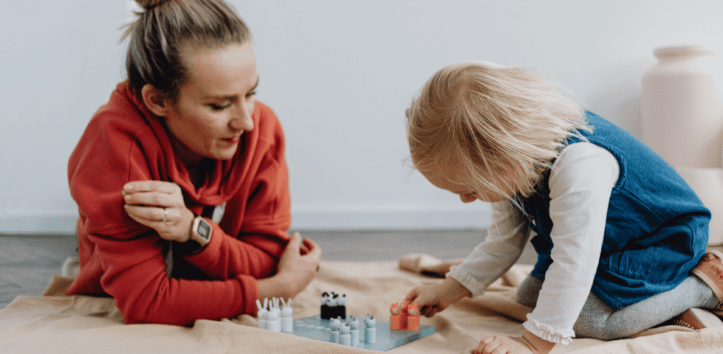 Child and therapist engaging in ABA therapy for behavioral improvement.