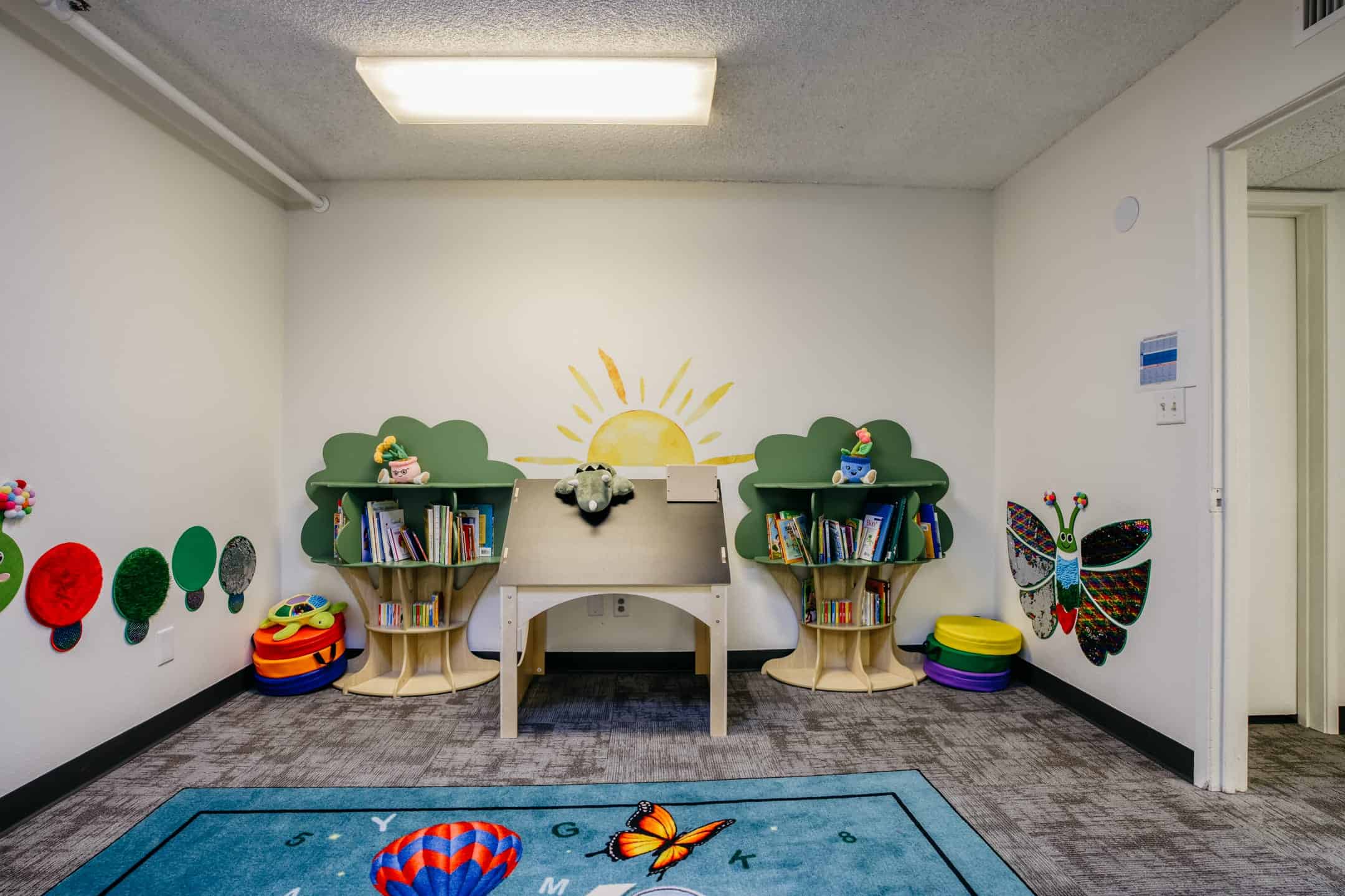 Accessible classroom for young children with educational decor and playful elements.