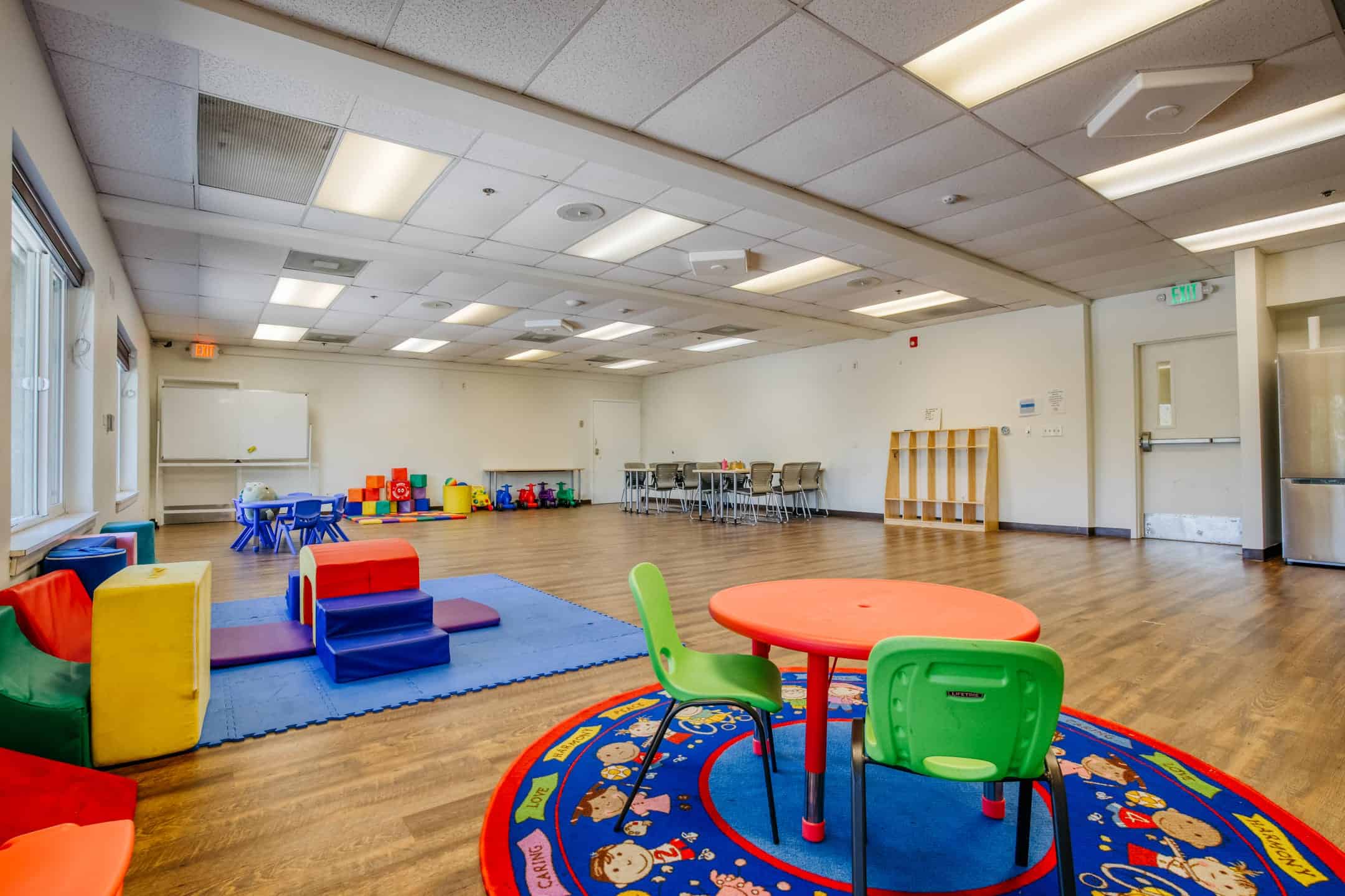 Child-friendly classroom with vibrant furniture and play zones for early education.