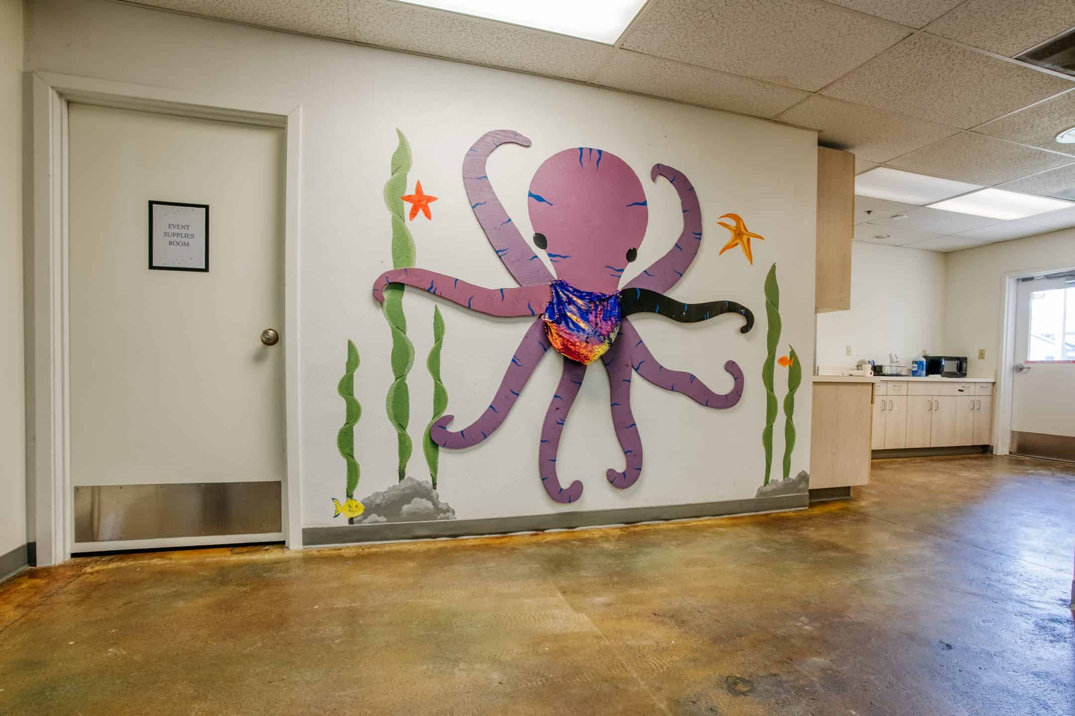 Colorful octopus mural in therapy center, promoting a welcoming environment.